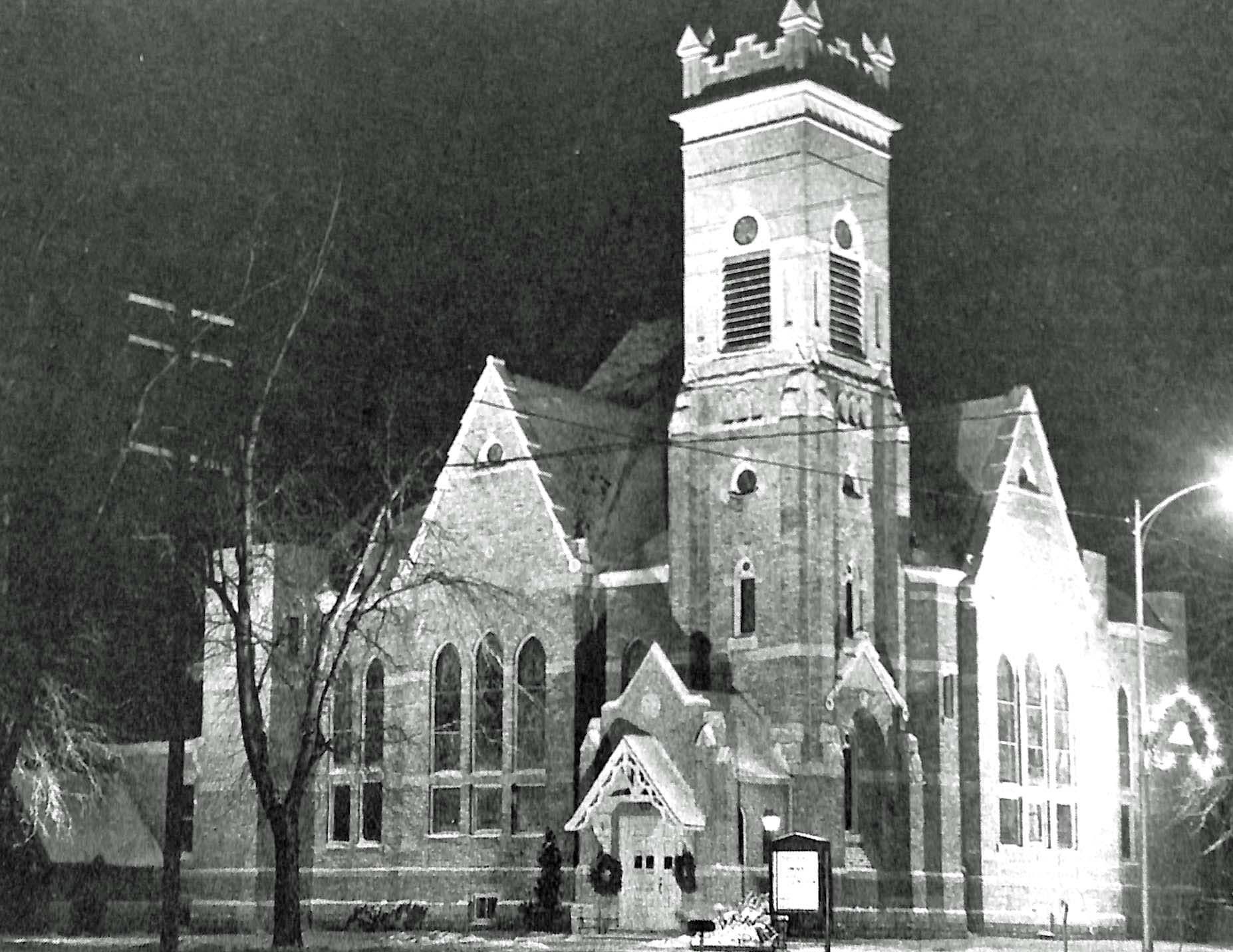 Church exterior at night.